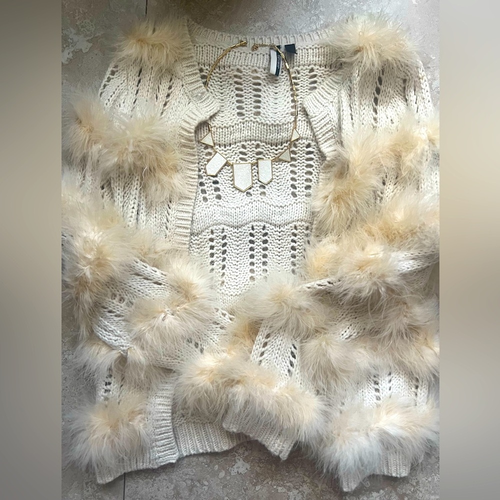 Elegant Cream Sweater with Faux Fur Accents with necklace